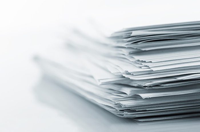 white_papers_io_solutions stack of white papers
