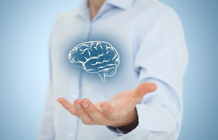 about_io_solutions_man_holding_brain business man holding a brain io solutions background image
